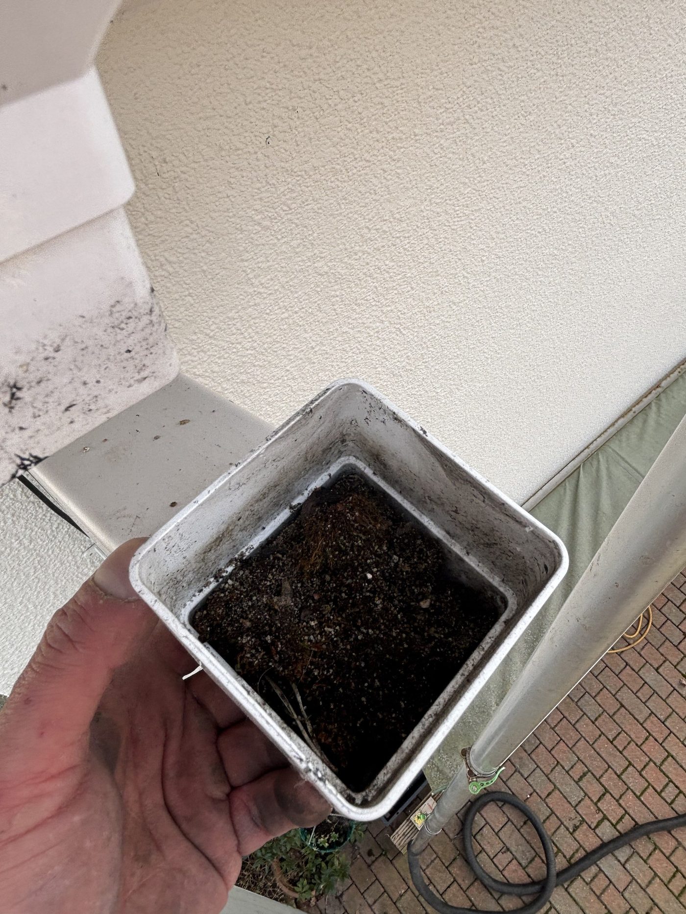 Downpipe hopper full of silt before cleaning