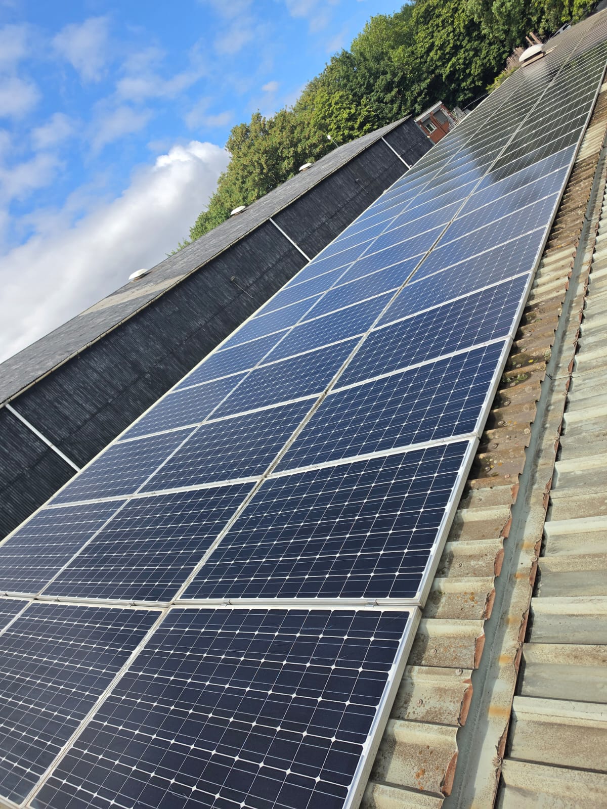 The same solar array clean and clear after cleaning
